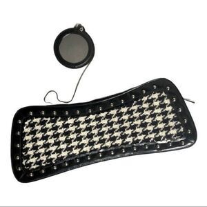 Trina Turk Houndstooth Clutch is ideal for any event or occasion.